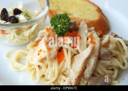 spaghetti white cream sauce fresh cream with fish eggs topping Stock Photo