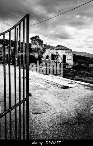Poggioreale, Sicily, Italy. 11th Jan, 2014. POGGIORELAE, Jan. 11, 2014 -- The entrance to the ghost town of Poggioreale destroyed by the earthquake in 1968 -- It was the night between 14th and 15th January 1968 when the earth started quaking. It was the beginning of the end for the village of Poggioreale, Sicily. All we have today is the skeleton of what it once was a delightful village. © Guglielmo Mangiapane/NurPhoto/ZUMAPRESS.com/Alamy Live News Stock Photo