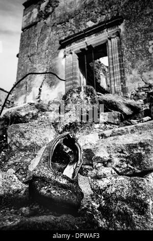 Poggioreale, Sicily, Italy. 11th Jan, 2014. POGGIORELAE, Jan. 11, 2014 -- An old shoe probably belonging to a woman who, during the earthquake, was trying to escape from her house -- It was the night between 14th and 15th January 1968 when the earth started quaking. It was the beginning of the end for the village of Poggioreale, Sicily. All we have today is the skeleton of what it once was a delightful village. © Guglielmo Mangiapane/NurPhoto/ZUMAPRESS.com/Alamy Live News Stock Photo