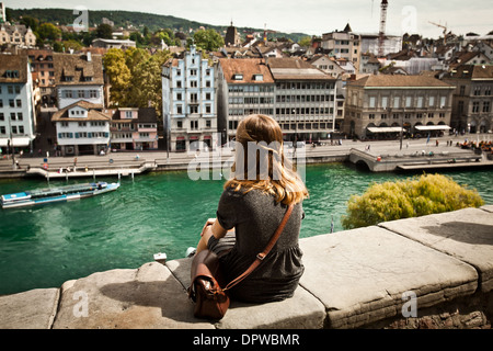 A young woman sightseeing beautiful view of Zurich, Switzerland Stock Photo