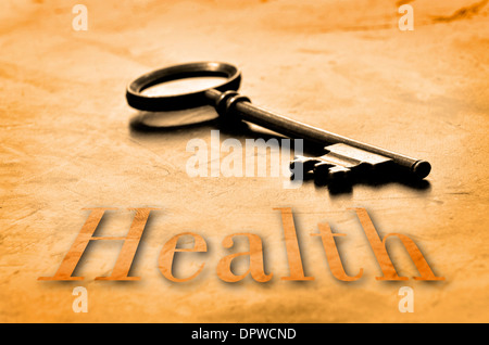 Key to Health on an old worn wooden desk top Stock Photo