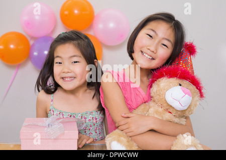 Cute little girls at a birthday party Stock Photo