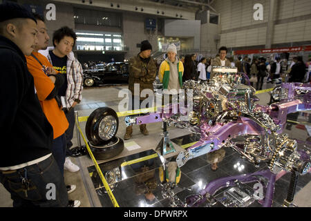 Nov 25, 2008 - Chiba, Japan - Customized classic cars showcasing the American lowrider culture are displayed at the Lowrider Japan Car Show which took place at Makuhari Messe Convention Center in Chiba, Japan. Pictured: Japanese fans look at a customized engine and car chassis. (Credit Image: © Christopher Jue/ZUMA Press)