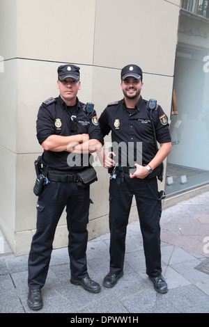 Two National Police Force Police officers (Policia Cuerpo Nacional de  Policía or CNP) Seville (Sevilla), Andalusia, Spain Stock Photo - Alamy