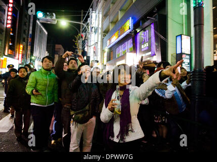 Dec 31, 2008 - Tokyo, Japan - People crowded the streets in the Roppongi district of Tokyo as they watch the final countdown to 2009 displayed from a distance at Tokyo Tower. (Credit Image: © Christopher Jue/ZUMA Press) Stock Photo
