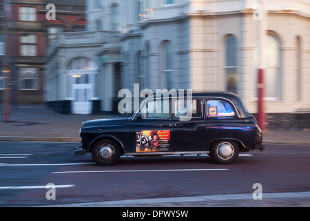 Hackney Cabs, Private Hire Vehicles for hire  Traditional black cab Taxis in Blackpool Town Centre, Lancashire, UK Stock Photo