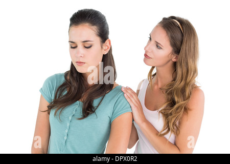 Young woman consoling female friend Stock Photo