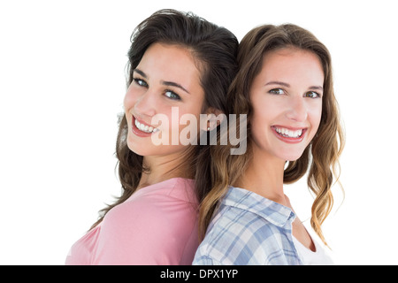 Side view portrait of two happy young female friends Stock Photo