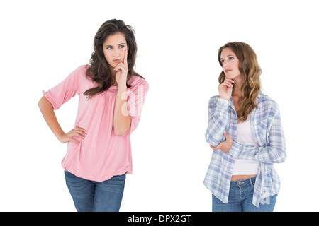 Two thoughtful casual young female friends Stock Photo