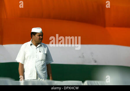 Apr 29, 2009 - New Delhi, NCR (National Capital Region), India - A Congress supporter listens to the speech of party president SONIA GANDHI during an election campaign rally.  Congress president Sonia Gandhi and her political rival Bharatiya Janata Party's (BJP) prime ministerial candidate L.K. ADVANI will be among the 1,567 candidates whose political fates will be decided tomorrow Stock Photo