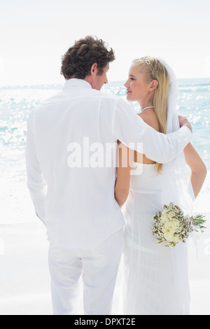 Happy bride and groom looking at each other Stock Photo