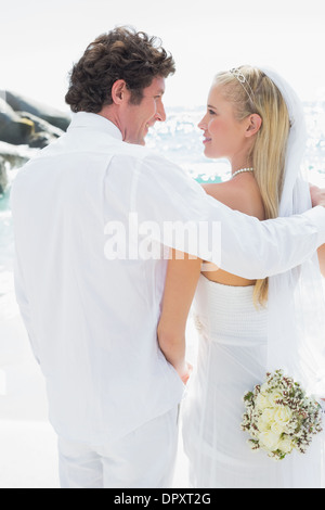 Smiling bride and groom looking at each other Stock Photo