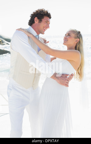 Groom dipping his pretty new wife while dancing Stock Photo