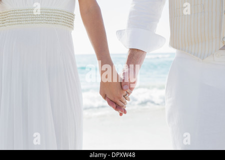 Newlyweds holding hands Stock Photo