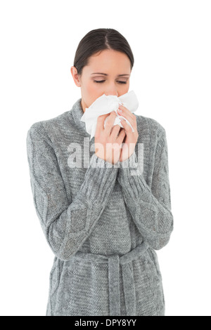 Casual young woman suffering from cold