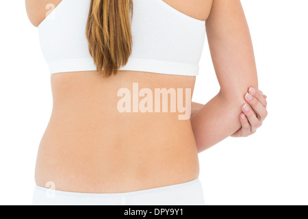 Rear view mid section of a fit woman with elbow pain Stock Photo