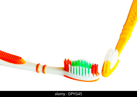 closeup detail of isolated colored toothbrushes on white with copy space Stock Photo