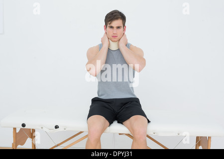 Portrait of a handsome young man wearing cervical collar Stock Photo