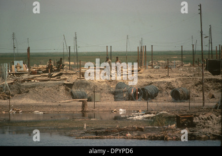 Iran Iraq war also known as First Persian Gulf War or Gulf War. 1984 Soldier recovering from recent battle amongst the devastation of war 1980s HOMER SYKES Stock Photo