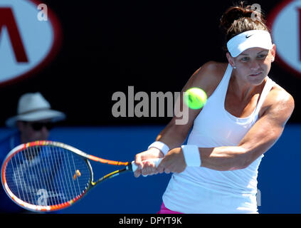 Melbourne. 17th Jan, 2014. Casey Dellacqua of Australia returns the ball during the women's singles 3rd round match against Zheng Jie of China at the 2014 Australian Open tennis tournament in Melbourne on Jan. 17, 2014. Casey Dellacqua won 2-0. Credit:  Jin Linpeng/Xinhua/Alamy Live News Stock Photo