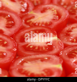 Group of red tomatoes forming a background Stock Photo