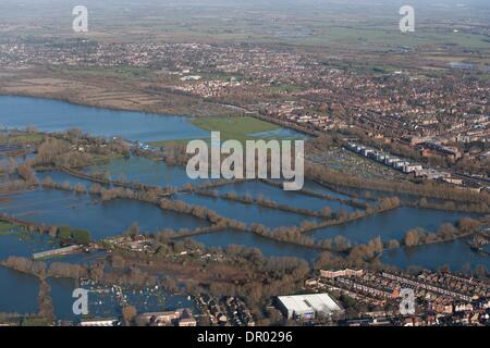 Oxford, UK. 14th January 2014. The  Thames, Oxford in  flood .  View North West over the Southern edge of Portmeadow   The  controversial Roger DudmanWay ( white) buildings  can be seen centre right bordering Portmeadow, hard up against the flooded allotments. Credit:  adrian arbib/Alamy Live News Stock Photo