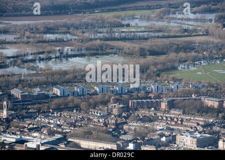 Oxford, UK. 14th January 2014. The  Thames, Oxford in  flood .  View  North towards Binsey  and the southern edge of  Portmeadow. a natural flood plain.  The controversial University buildings  of Roger Dudman Way  can  be seen ( centre )  along railway lines. Credit:  adrian arbib/Alamy Live News Stock Photo