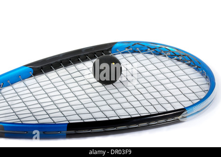 squash ball on a racket Stock Photo