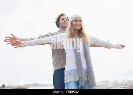 Happy casual young couple stretching hands out Stock Photo