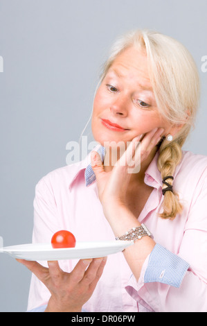 ELDERLY PERSON EATING Stock Photo