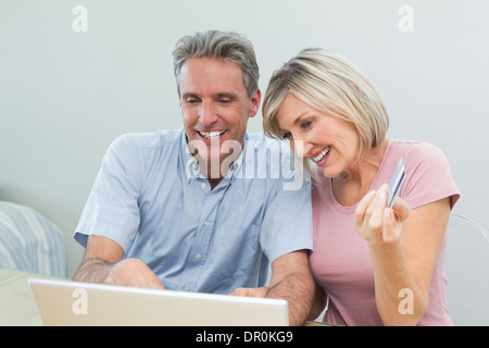Couple doing online shopping at home Stock Photo