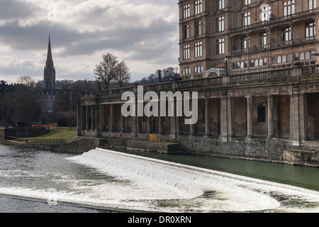 Bath City, Somerset. View across the River Avon to the Grand Parade, the Empire building & 'Saint John The Evangelist' church