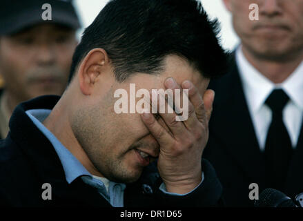 December 09, 2008. San Diego,  CA.     Husband and father DONG YUN YOON visited the remains of his University City home, the day after a military F-18D crashed into the structure killing his wife, two young daughters and his mother-in-law. He tearfully addressed the media giving thanks to his church and those who have supported him in this terrible time. The family had only just mo Stock Photo