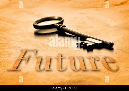 Key to the Future on an old worn wooden desk top Stock Photo