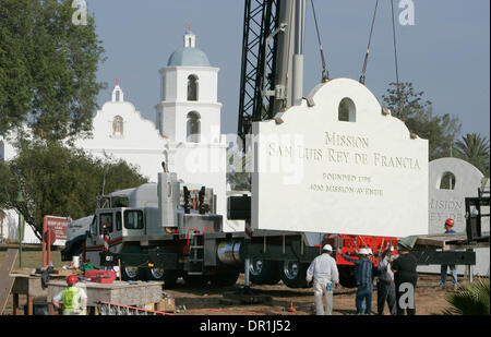 December 4, 2008, Oceanside, California, USA A section of the Mission San Luis Rey's new 12 foot tall concrete sign is lowered into place on its base in this view that shows the Mission in the background. Another panel of the same shape, but with writing facing the opposite direction, will be ''sandwiched'' with this panel, with pillars on each end and a decorative ''cap'' placed o Stock Photo