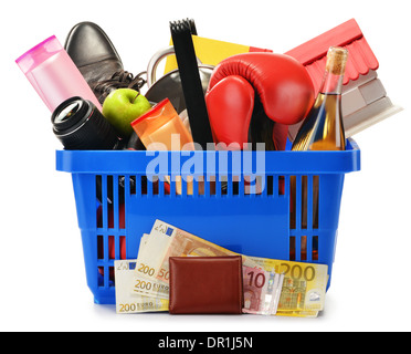 Variety of consumer products in plastic shopping basket isolated on white Stock Photo