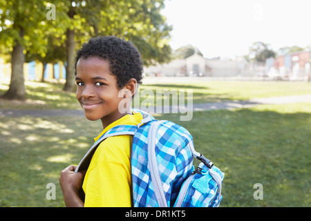 Mixed race boy smiling outdoors Stock Photo