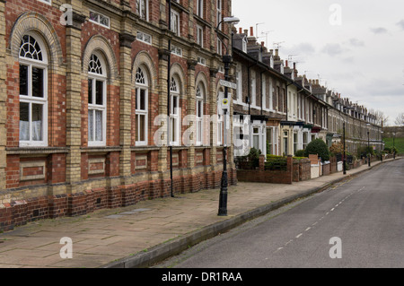 Newton Terrace in residential area of city (uniform row of Victorian terrace houses & historic converted chapel) - York, North Yorkshire, England, UK. Stock Photo