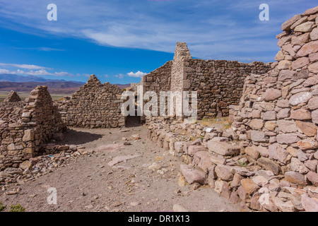 Abandoned rock houses missing roofs on Salar de Uyuni in southern Bolivia. Stock Photo