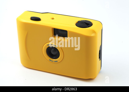 yellow camera shoot and go over white Stock Photo