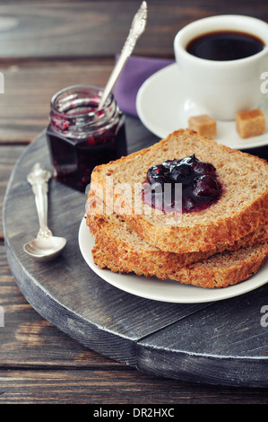 Breakfast with toast, fruit jam and coffee on tray Stock Photo