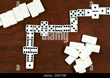 top view of dominoes playing on wooden table Stock Photo
