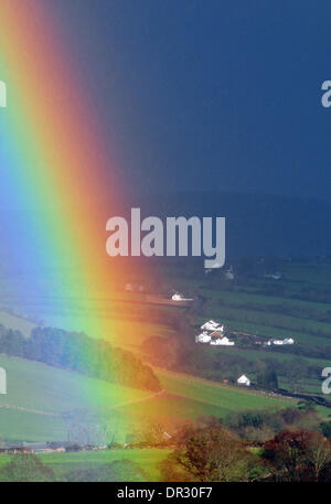 Aberystwyth, Wales, UK. 18th Jan, 2014.  For the second time in two days, a rainbow crosses the view of the Cambrian Mountains behind Capel Dewi, Aberystwyth, Wales, UK as showers sweep across the valley - 18 Jan 2014. Credit:  John Gilbey/Alamy Live News Stock Photo