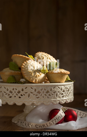 Festive homemade mince pies for Christmas on cake stand Stock Photo
