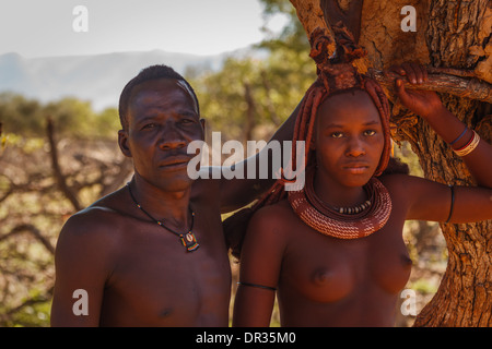 African couple pose for portrait on Himba tribal land in Daramaland Namibia Stock Photo
