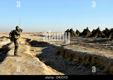 Special Forces soldier scans an area in Kandahar province, Afghanistan, Stock Photo