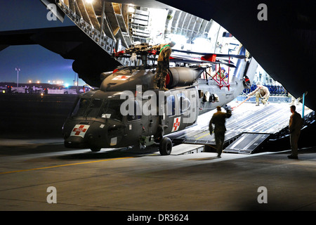 HH-60M Medical Evacuation helicopter unloaded from a C-17 aircraft, Afghanistan. Stock Photo
