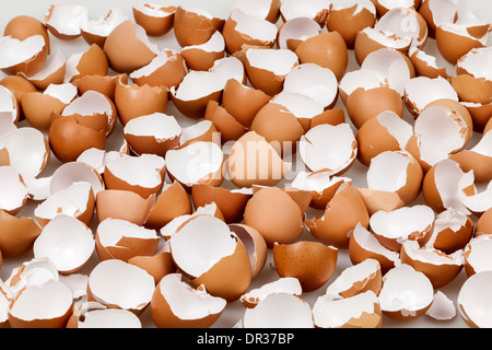 Background of many broken brown empty eggshells Stock Photo