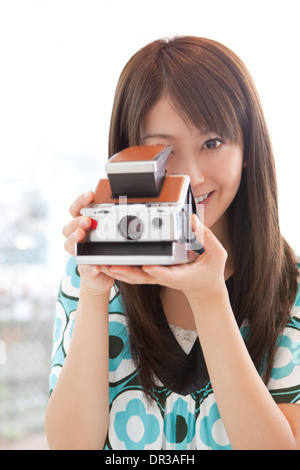 Young woman taking photo Stock Photo