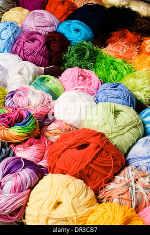 Different color threads on rows in the store Stock Photo